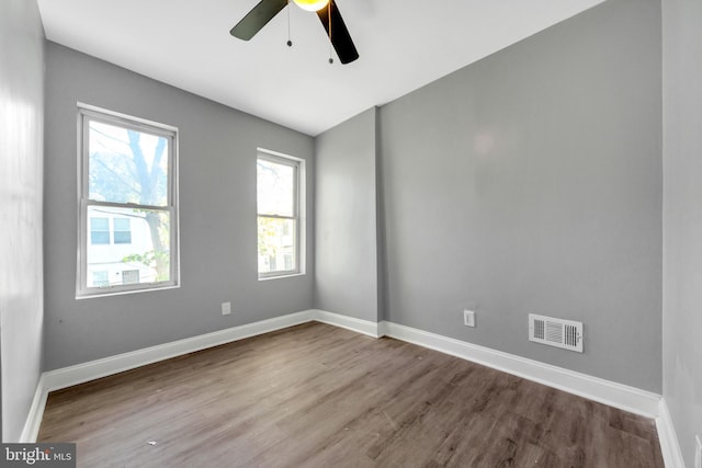 unfurnished room with hardwood / wood-style flooring and ceiling fan