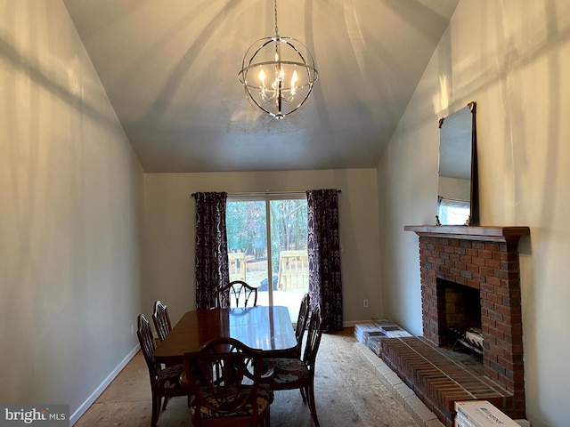 dining room with a notable chandelier and a fireplace