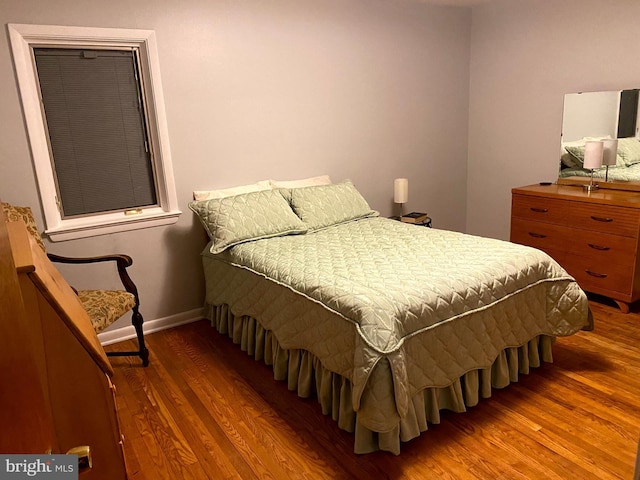 bedroom featuring hardwood / wood-style flooring