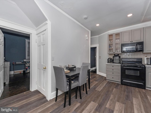 kitchen featuring tasteful backsplash, dark hardwood / wood-style flooring, ornamental molding, black appliances, and gray cabinetry