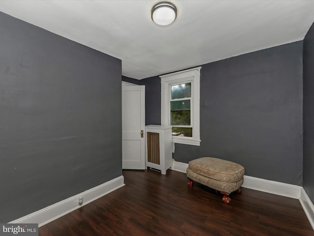 sitting room featuring dark hardwood / wood-style floors