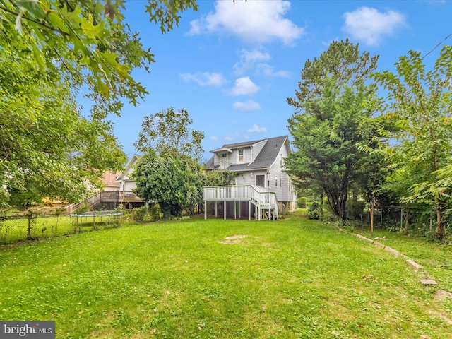 view of yard with a wooden deck