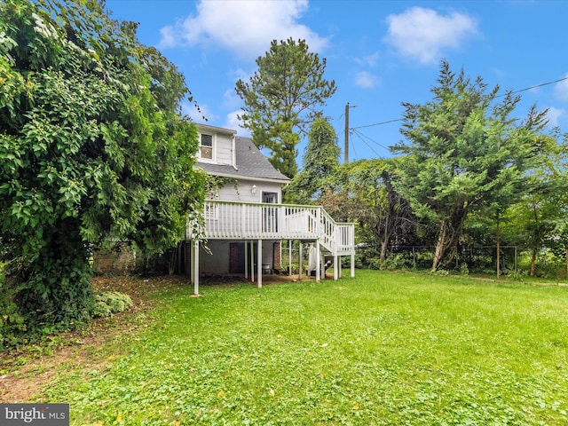 view of yard with a wooden deck