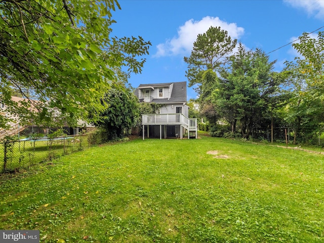 view of yard with a wooden deck