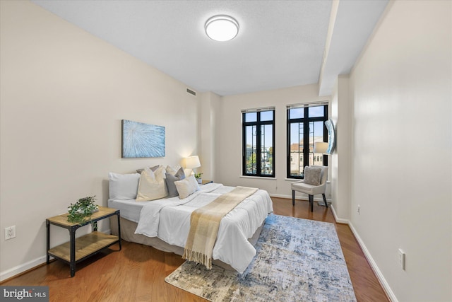 bedroom featuring hardwood / wood-style flooring