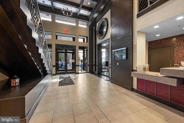 reception area with a notable chandelier and french doors