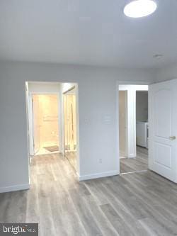 unfurnished room with light hardwood / wood-style floors