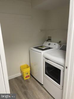 laundry area featuring light hardwood / wood-style flooring and washer and dryer