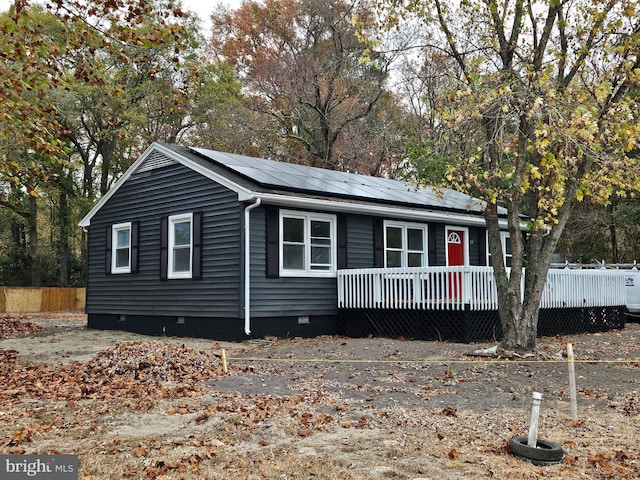 view of front of house featuring solar panels