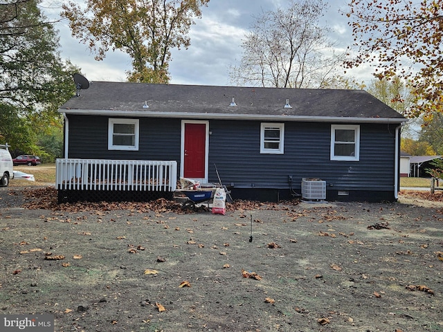 rear view of property with central AC unit