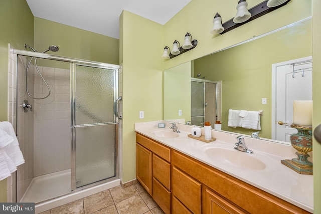 bathroom with vanity, tile patterned floors, and a shower with shower door