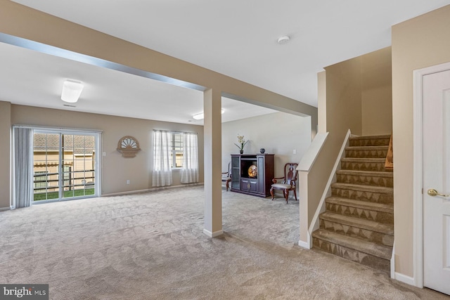 basement with light carpet and plenty of natural light