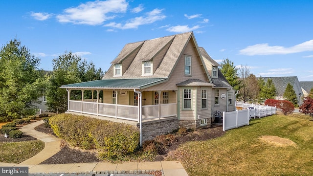 exterior space with a lawn and covered porch