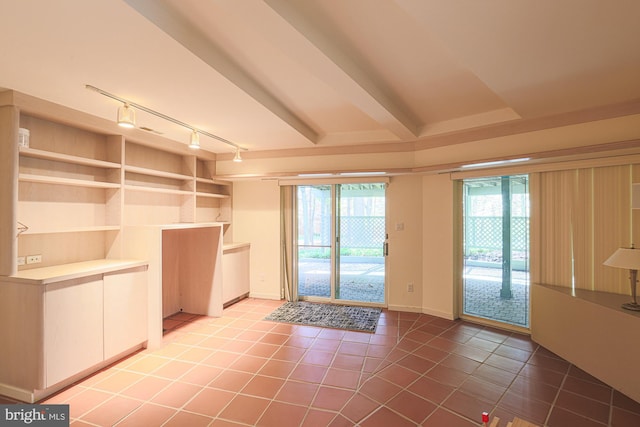 entryway featuring tile patterned floors and track lighting