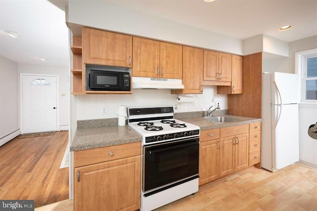 kitchen with white appliances, tasteful backsplash, light hardwood / wood-style flooring, and sink