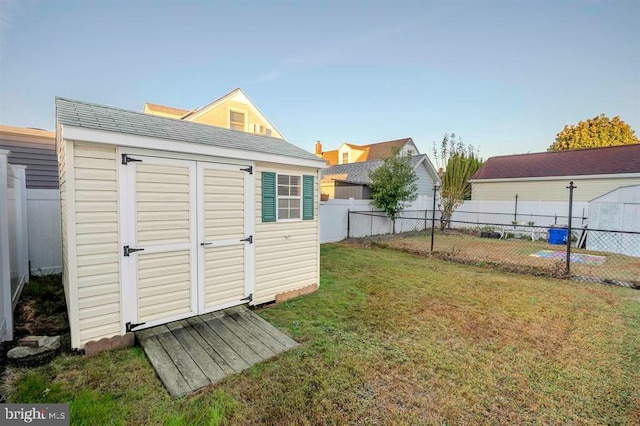 view of outbuilding with a yard