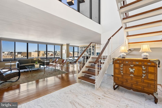 staircase with hardwood / wood-style flooring