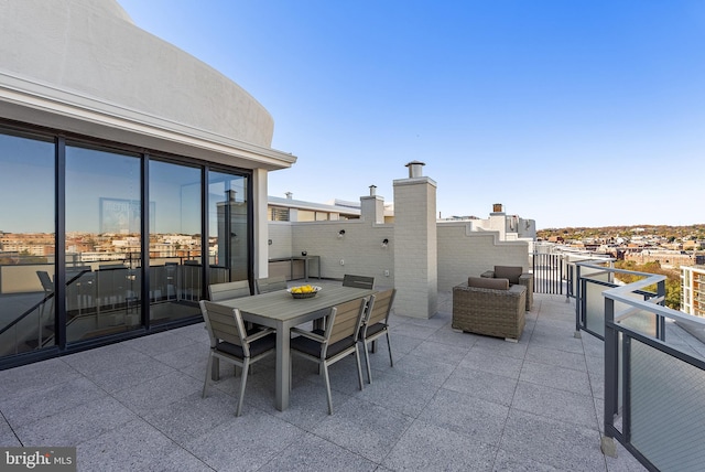 view of patio / terrace with a balcony