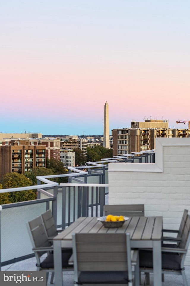 view of balcony at dusk