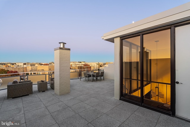 view of patio terrace at dusk