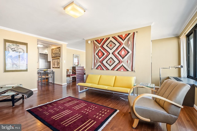 living room featuring dark hardwood / wood-style floors and ornamental molding