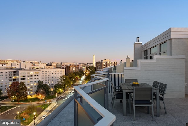 view of balcony at dusk