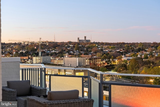 view of balcony at dusk