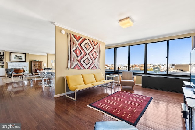 living room featuring hardwood / wood-style floors and crown molding