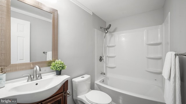 bathroom featuring toilet, vanity, and bathing tub / shower combination