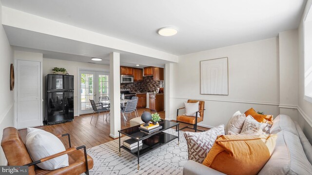 living room with light wood-style floors and baseboards