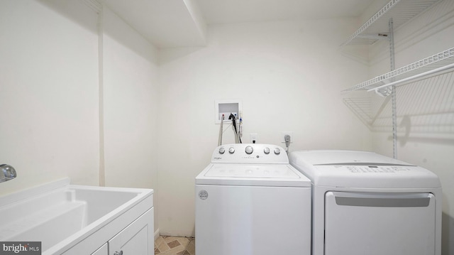 laundry room with separate washer and dryer