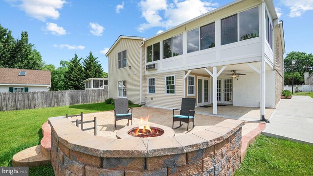 rear view of property with an outdoor fire pit, french doors, a patio, and a ceiling fan