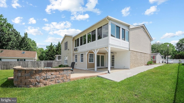 rear view of property featuring a patio area and french doors