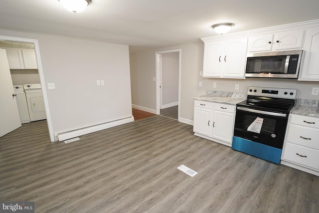 kitchen with appliances with stainless steel finishes, light wood-type flooring, separate washer and dryer, baseboard heating, and white cabinets