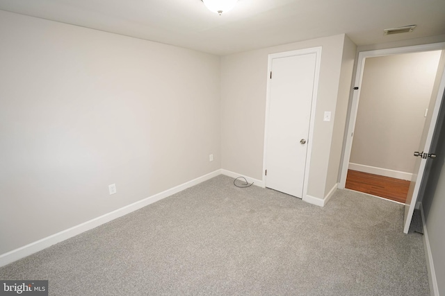 unfurnished bedroom with light carpet