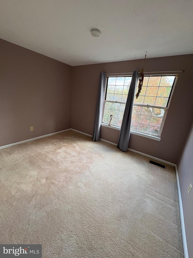 view of carpeted spare room