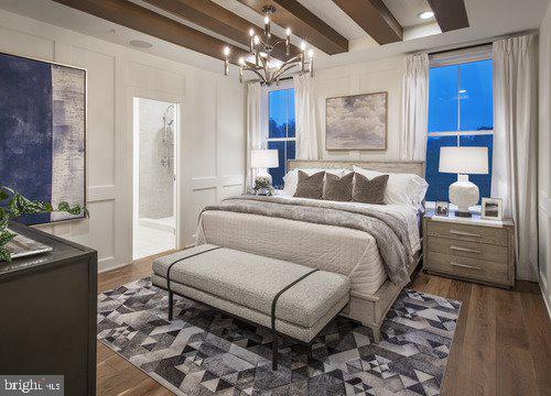 bedroom with beamed ceiling, a chandelier, ensuite bathroom, and dark hardwood / wood-style flooring