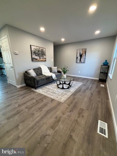 living room with dark wood-type flooring