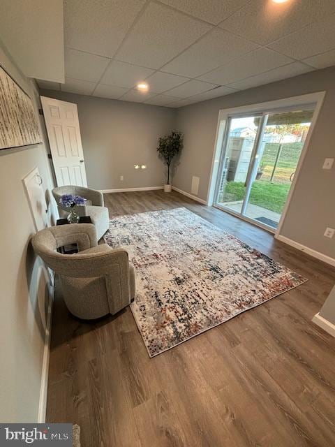 sitting room featuring hardwood / wood-style floors and a paneled ceiling