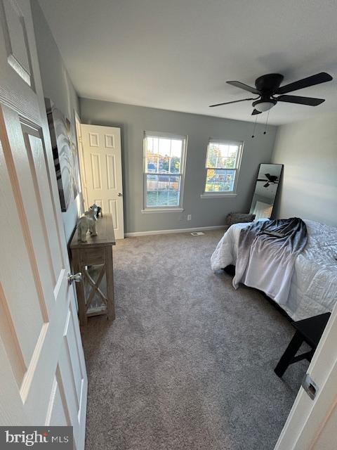 carpeted bedroom featuring ceiling fan