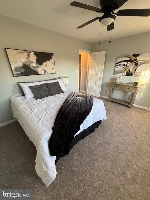 carpeted bedroom with ceiling fan