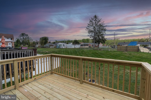 deck at dusk with a lawn