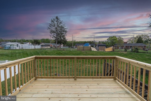 deck at dusk with a lawn