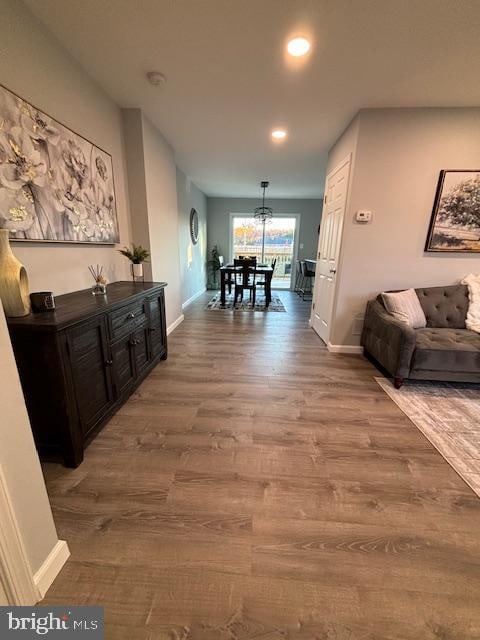 corridor with hardwood / wood-style floors