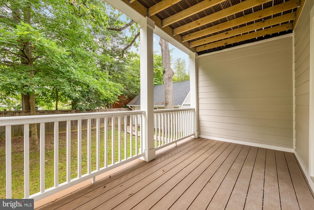 wooden deck with a yard