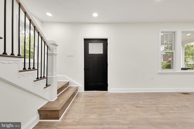 foyer entrance with light hardwood / wood-style flooring