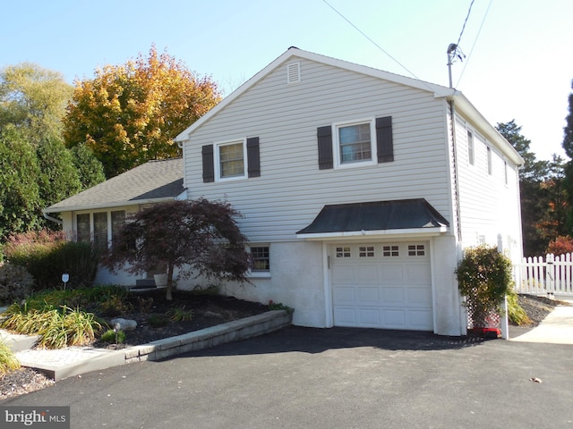 front facade with a garage