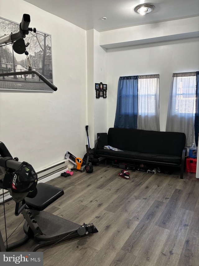 workout area with wood-type flooring