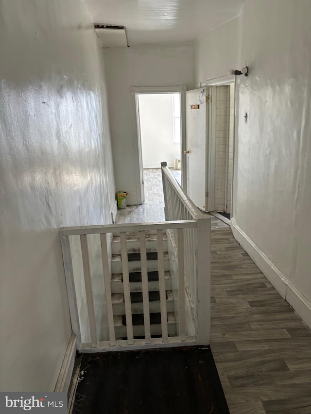 hall with dark wood-type flooring