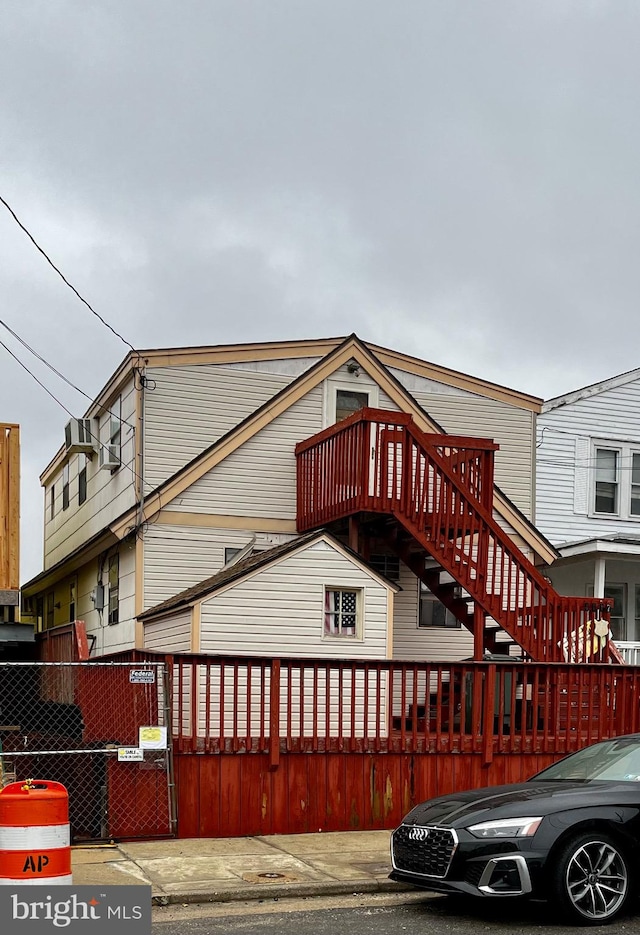 view of front facade featuring cooling unit and a deck